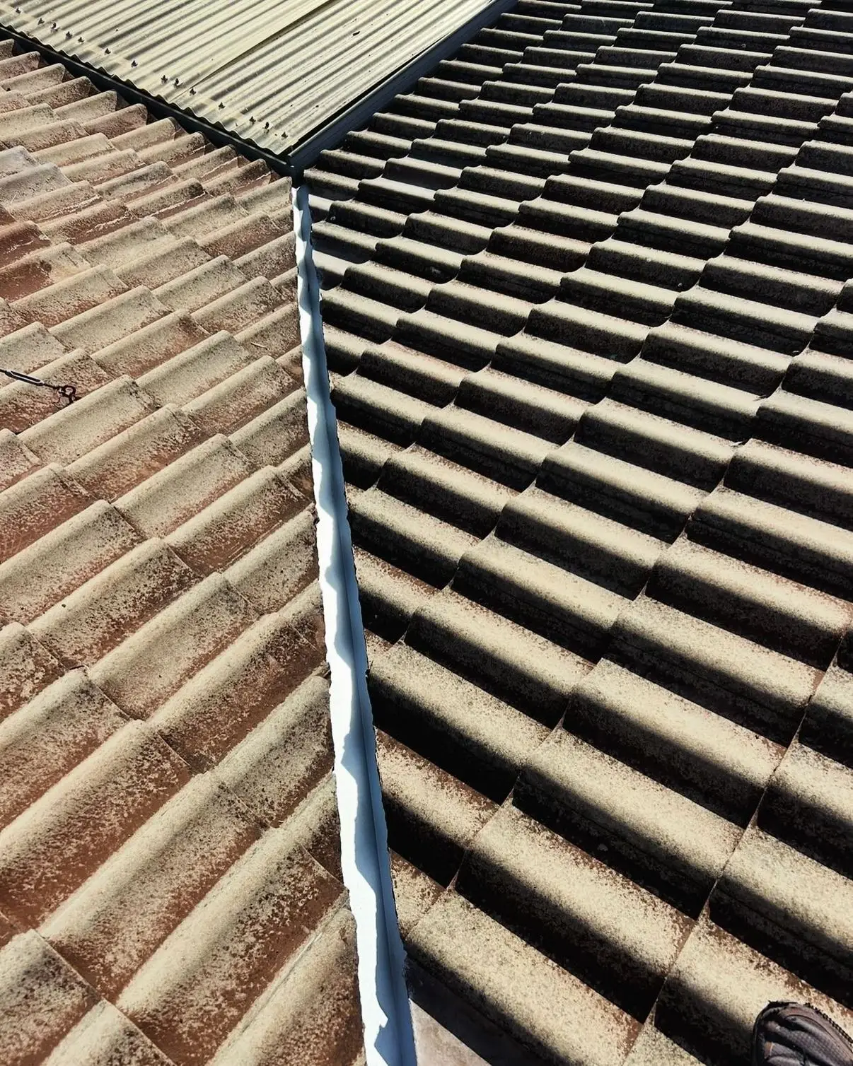 Valley iron between terracotta and dark tiles